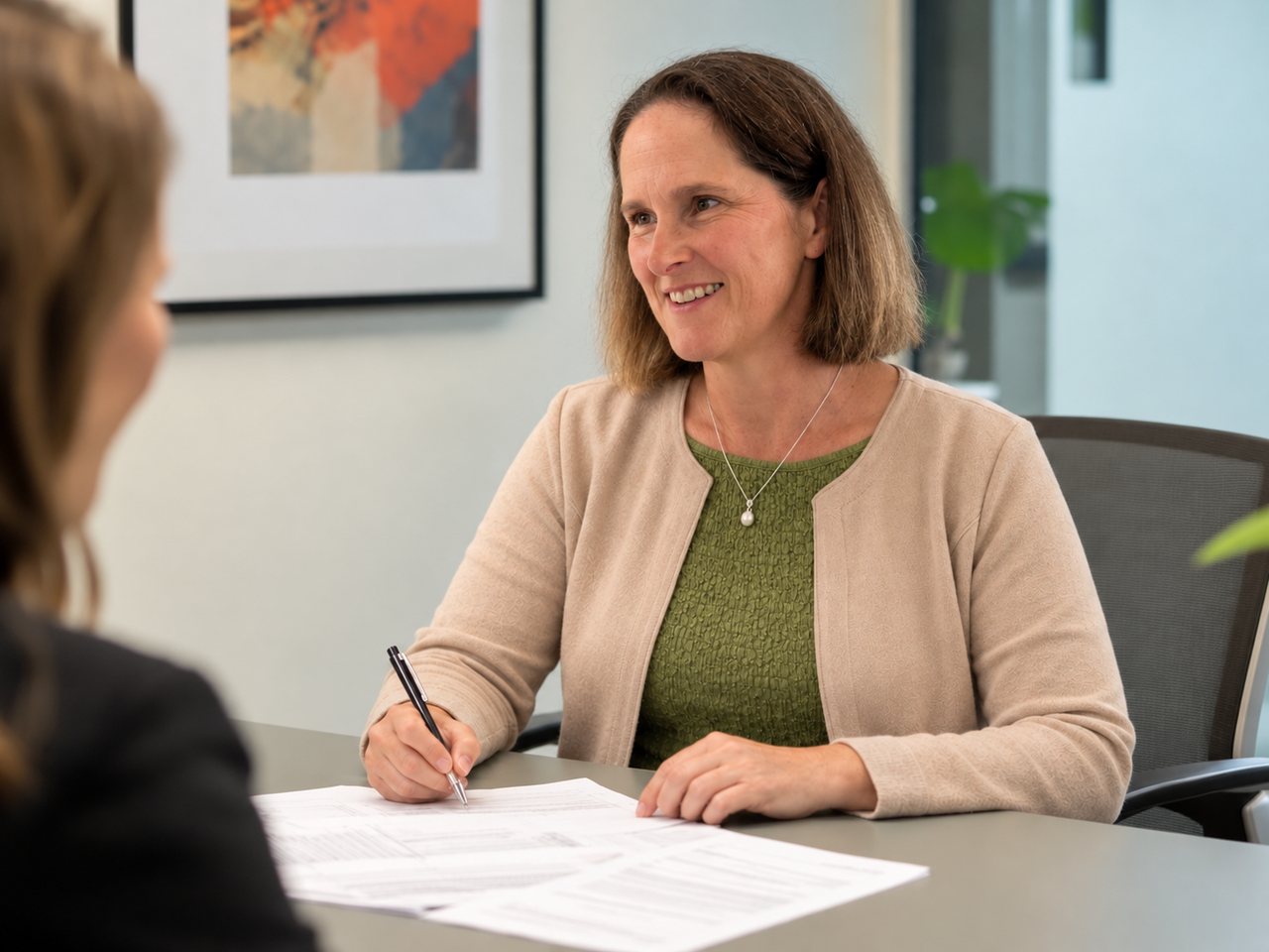 Menopause consultation — women’s health and hormones Kathleen Cornmell in a menopause and hormones consultation with a client
